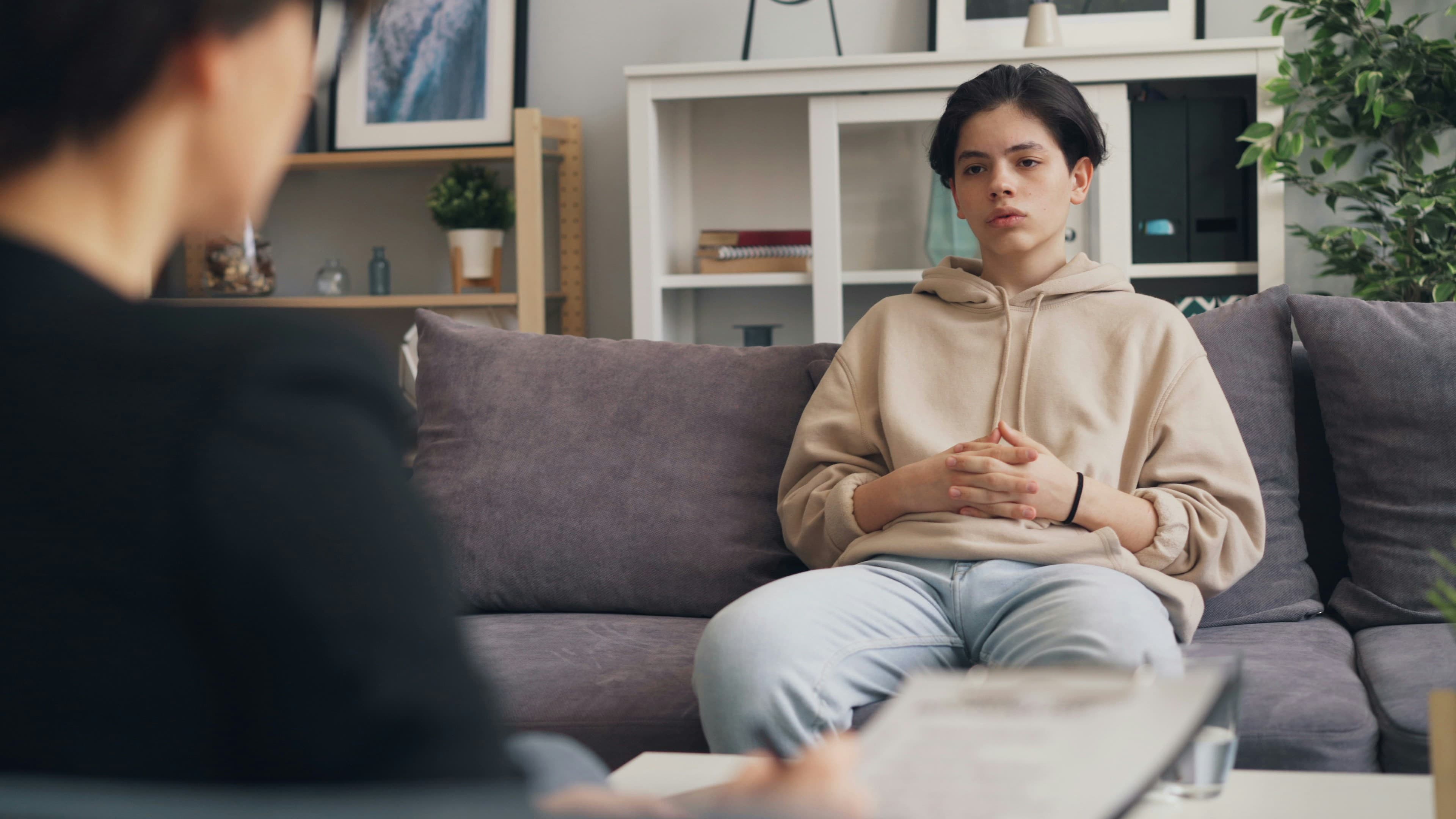 A speech-language professional working with a family